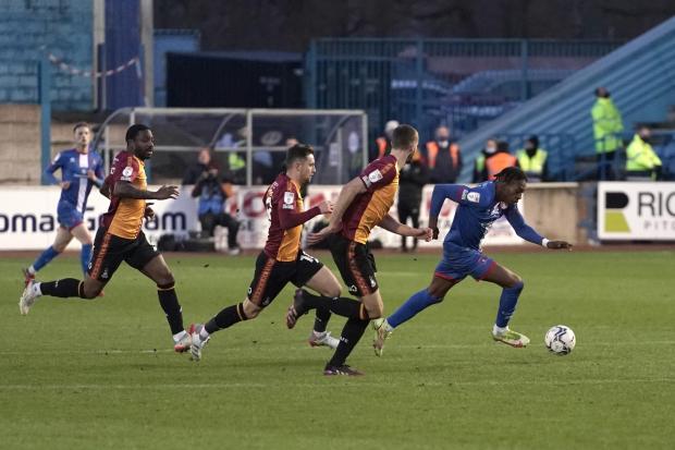 News and Star: Omotoye breaks clear of a host of Bradford players