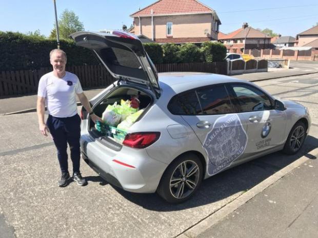 News and Star: John Halpin in his role as United's community sports trust manager, pictured delivering items to vulnerable people during the Covid pandemic
