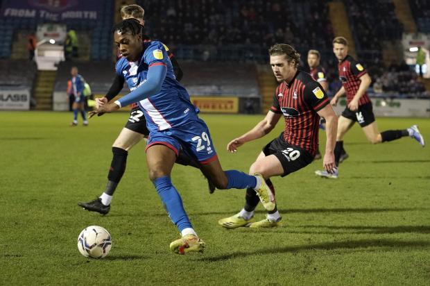 News and Star: Omotoye tries to get away from Pools' defence