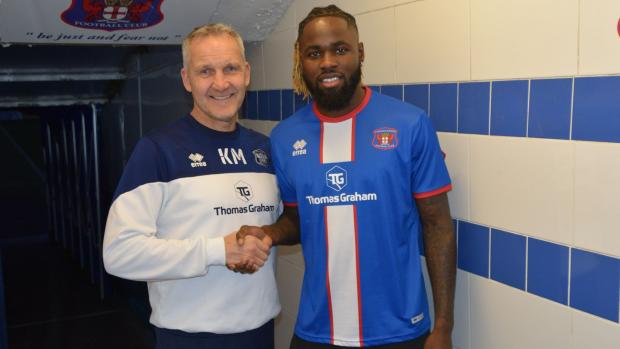News and Star: Keith Millen with Simeu at Brunton Park (photo: Amy Nixon)