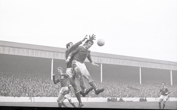 News and Star: United's Bob Hatton challenges the Forest keeper
