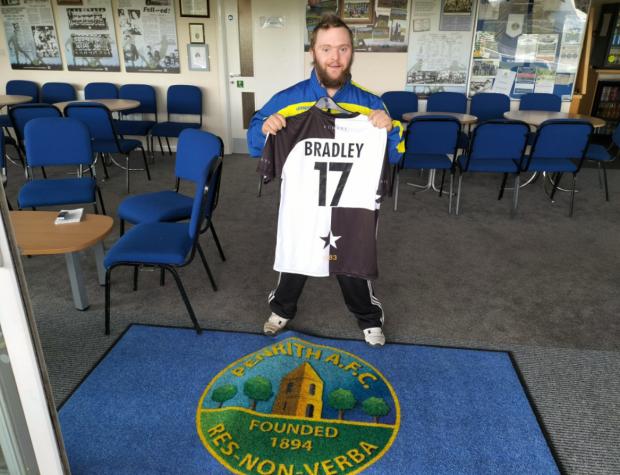 News and Star: Bradley with the shirt presented to him by Ashington - since when other clubs have followed suit