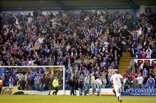 News and Star: Some United fans are on the pitch as the Blues celebrate Hawley's goal