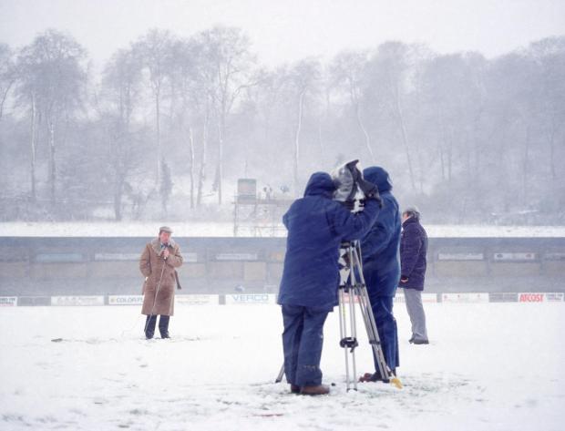 News and Star: Stuart Roy Clarke's photo of John Motson in the snow at Wycombe in 1990