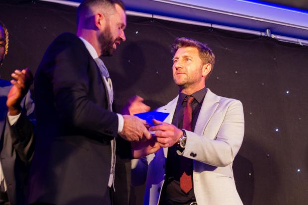 News and Star: Coach Paul Gerrard, right, presents Howard with an award