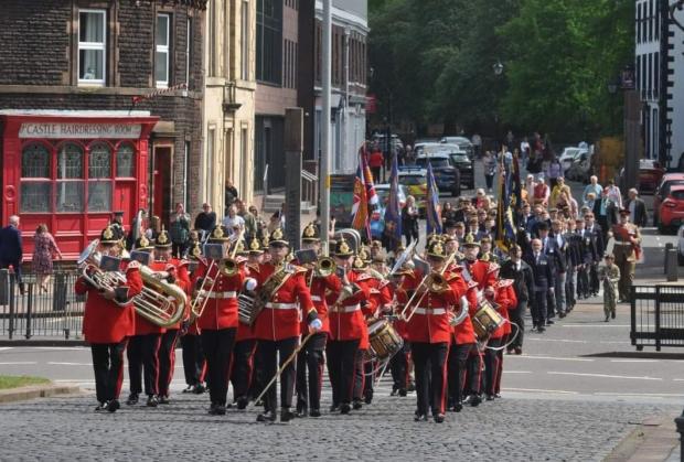 News and Star: MARCH: Veterans from the Border Regiment, King’s Own Royal Border Regiment, and the Duke of Lancaster’s Regiment march behind the Band of The Duke of Lancaster’s Regiment
