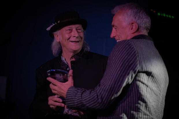 SUCCESS: Nick receives the award from rock legend Del Bromham.