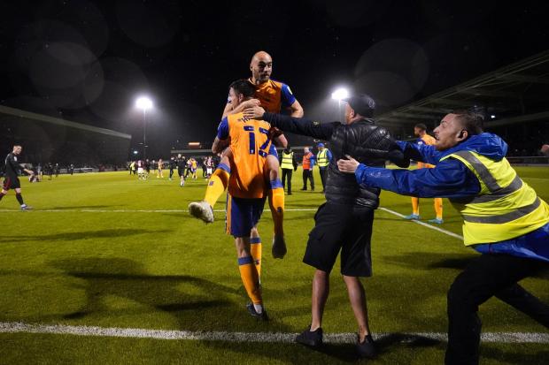 Mansfield celebrate their win at Northampton (photo: PA)