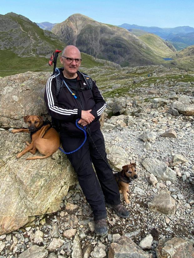 News and Star: TRIUMPH: Ian climbing Scafell Pike for the first time