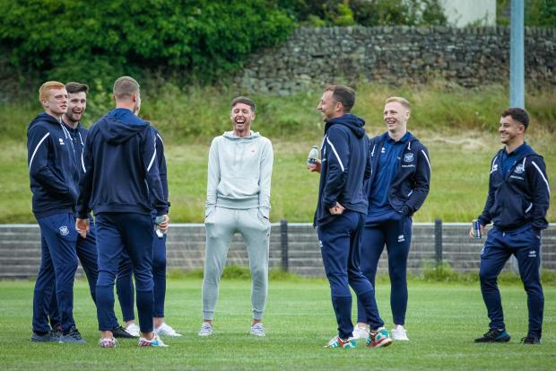 Jamie Devitt, centre, shares a joke with United team-mates (photo: Barbara Abbott)