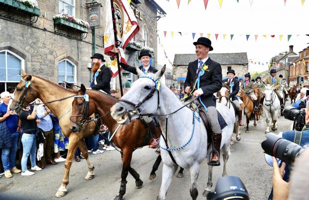 News and Star: Langholm Common Riding cavalcade passing the town centre stage.