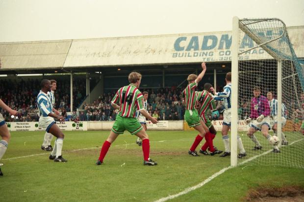 David Reeves, arm raised, scores the crucial goal at Colchester in 1995