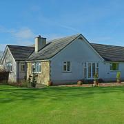 Solway Bungalow is a well-presented and spacious home with beautiful gardens and great views of countryside and fells