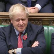 Prime Minister Boris Johnson  listens to Labour leader Jeremy Corbyn speaking in the House of Commons, London. PA Photo. Picture date: Tuesday October 29, 2019. The UK is on course for a December general election after Jeremy Corbyn announced that