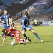 Carlisle's Jon Mellish, right, puts pressure on the Crawley defence (photo: Barbara Abbott)