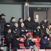 Steve Bruce, back right, next to Roy Keane, with Paul Scholes, third right, and Ryan Giggs, second left, also watching the game (photo: Barbara Abbott)