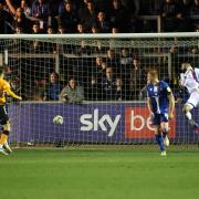 Micky Demetriou's header finds the Carlisle net for Newport's opening goal (photos: Barbara Abbott / Ben Holmes)