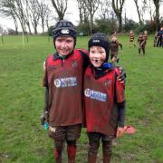 MUCKY: Brady Wilson and Kerr Gordon at a very muddy and wet Annan tournament