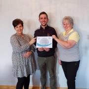 GOLF: Adam McAllister, England Golf Club Support Officer presenting Whitehaven's Chartership Certificate to Lynne (right) as Charter Champion and Karen Lawson, Golf Club Manager (left)