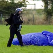 Tom Cruise was spotted parachuting out of a helicopter as he filmed scenes for his new film in the Lake District