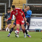 Ashley Nadesan pictured in action against United in Crawley's 1-0 defeat at Brunton Park on 2022/23's opening day