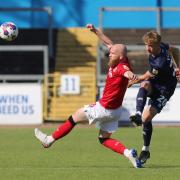 Jack Ellis clears the ball under pressure from Swindon's Jonny Williams (photos: Richard Parkes)