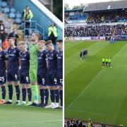 United players stood for a minute's silence before a rendition of the National Anthem (main photo: Barbara Abbott)