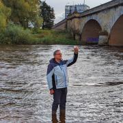 Councillor Brian Wernham in the River Eden