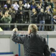 Paul Simpson salutes fans after the victory