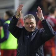 Paul Simpson applauds United's fans after the victory