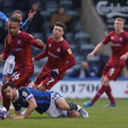 JK Gordon, left, and Jordan Gibson, centre: key players in United's win at Rochdale