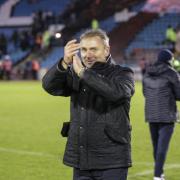 Paul Simpson applauds the fans after the 5-1 win