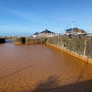 The water in Whitehaven Harbour has been discoloured for 16 months