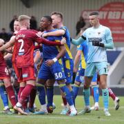 United and Wimbledon players square up in the first half