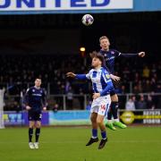 Carlisle's Callum Guy wins a header against Colchester's Noah Chilvers during Saturday's 1-0 win