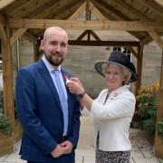 Chris Armstrong receiving his British Empire Medal
