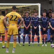Carlisle players line up in a defensive wall at Sutton