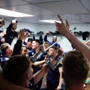 Jamie Devitt's crutches get in on the act as United toast their victory