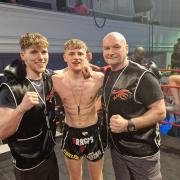17-year-old Muay Thai fighter Matty Mcleish celebrates a victory with his father Matty Mcleish Snr.