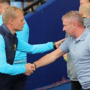 Liam Manning, left, with Paul Simpson before kick-off