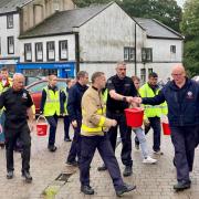 Firefighters passed a bucket of water between one another on a nine-mile route to Whitehaven