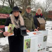 Settle Carlisle Railway Development Company General Manager, Susie Payne, Penrith and District Red Squirrel Group ranger, Gary Murphy and Settle Carlisle Railway Development Company volunteer Derek Payne preparing to install the new red squirrel feeders,