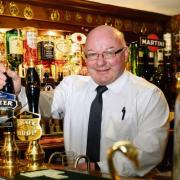 Joe Fagan pulls one of his last pints in the Swan Inn