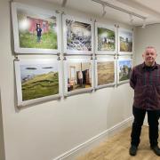 Photography lecturer Rob Sara with his work in the Vallum Gallery
