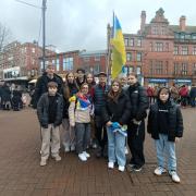 Olga pictured with her three children with their friends at Carlisle vigil on February 24