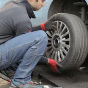 A vehicle is having its tyre changed