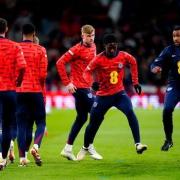Jarrad Branthwaite, third from right, takes part in the warm-up before the England-Brazil game