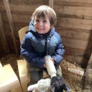 All smiles whilst feeding the lambs!