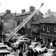 A fire rescue in Grapes Lane, Carlisle in 1966 attracted crowds of onlookers as the turntable ladder climbs above the rooftop