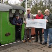 Harold Bowron (sunglasses) presenting the cheque to the South Tynedale Rail Preservation Society